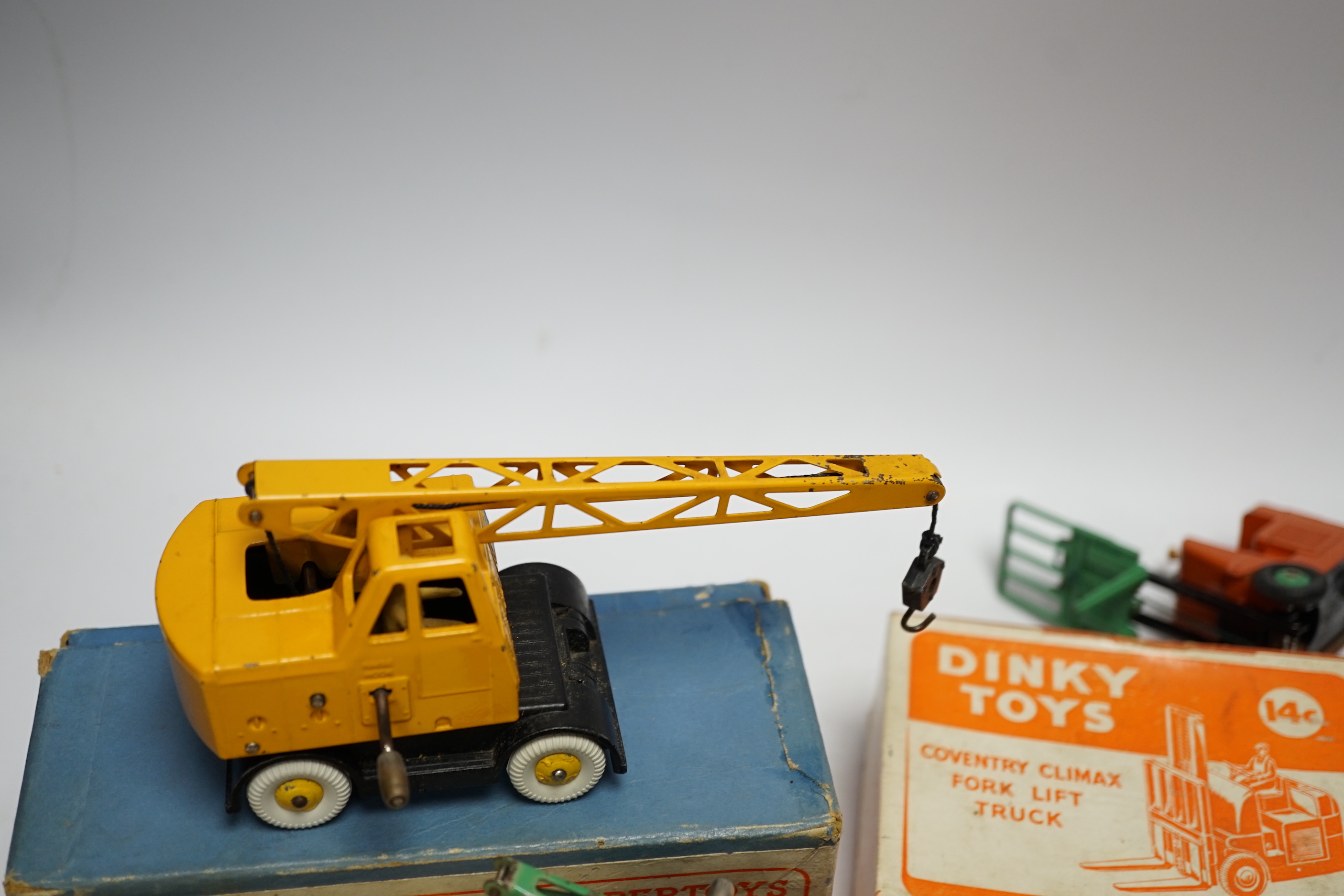 Five boxed dinky toys including (25x) breakdown lorry, (410) Bedford End Tipper, (555) Fire Engine, (571) Coles Mobile Crane, and (14c) Coventry Climax Fork Lift Truck